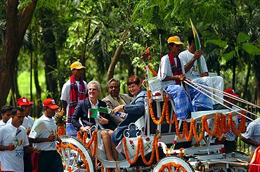 Louise Martin in Balgldesh with the Queen's Baton